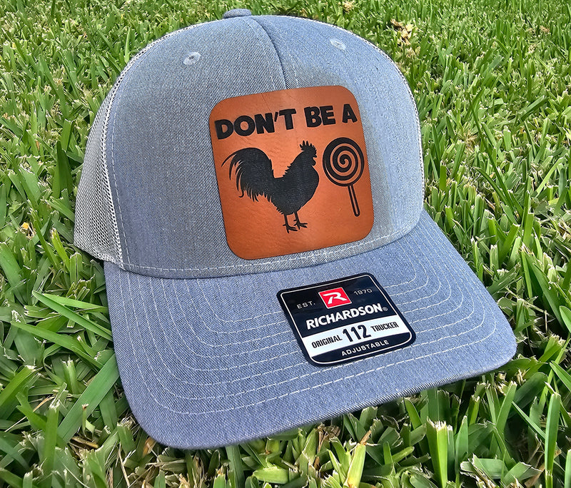 SUCKER Snapback Hat