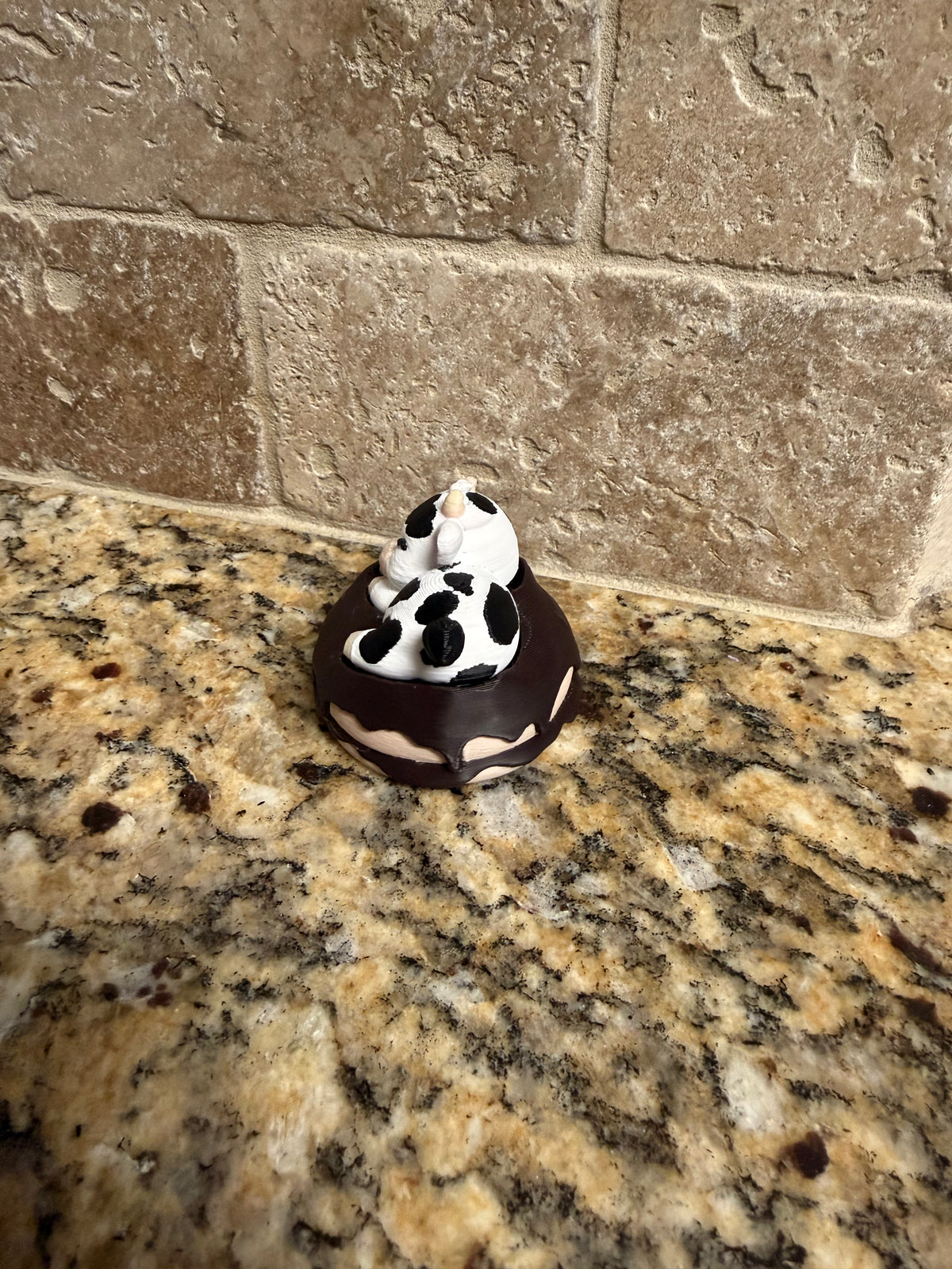 Sleeping dairy cow on a donut clicker