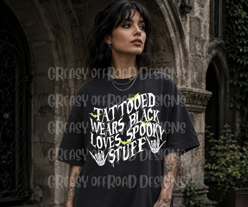 Tattooed, wears black, loves spooky stuff